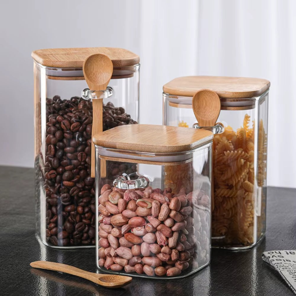 glass storage jars filled with coffee, beans, pasta, rice, herbs, tea and more