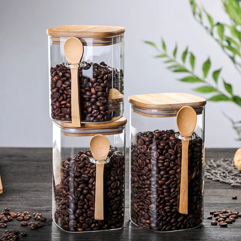 Stackable square glass jars (500ml, 800ml, 1000ml, 1200ml) with bamboo lids for pantry organization.